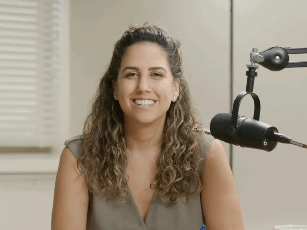 A creator at a desk with two microphones